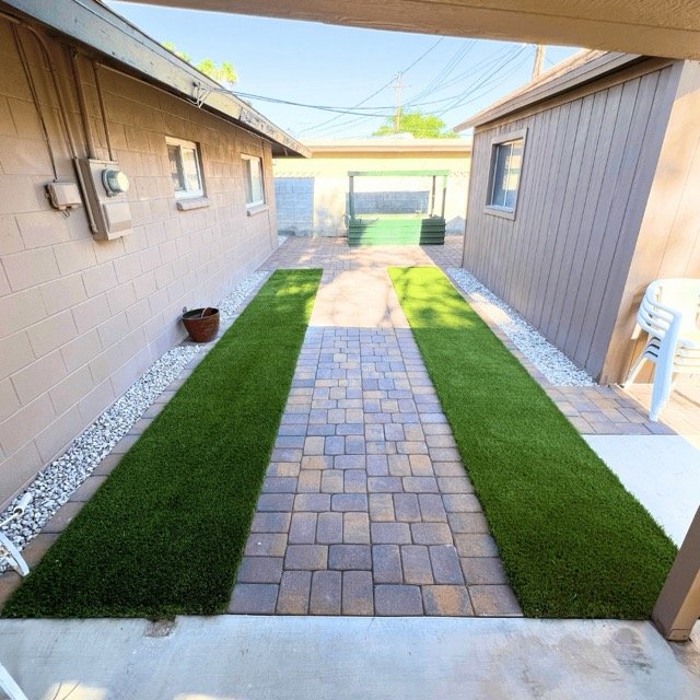 Low-maintenance backyard makeover with hardscaping and artificial turf