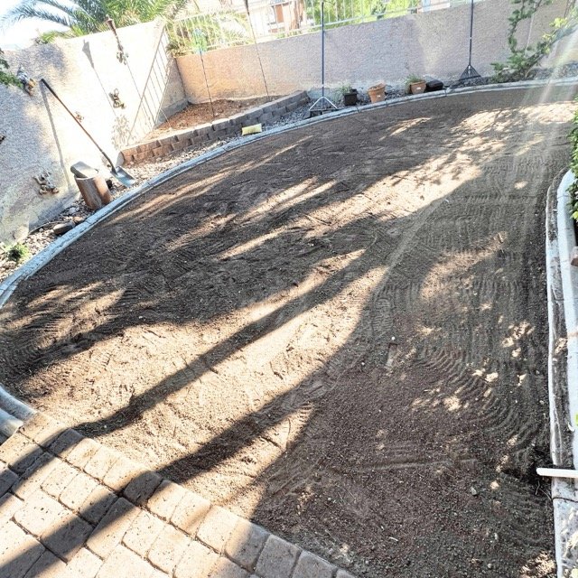 Preparing the yard for new grass: Soil and edging in place